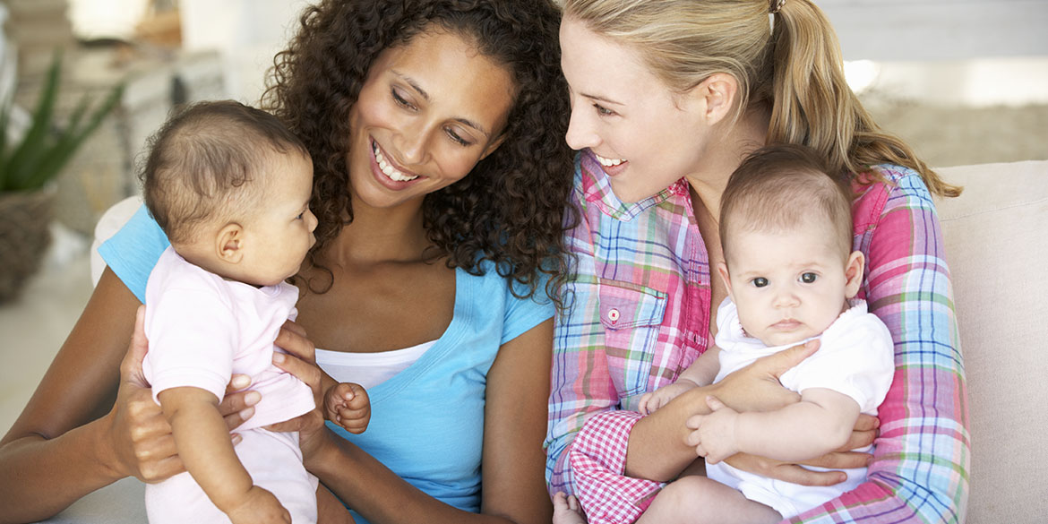 Two women holding babies.