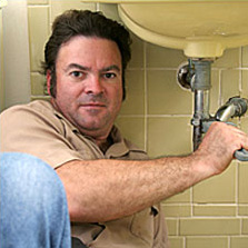 plumber fixing sink