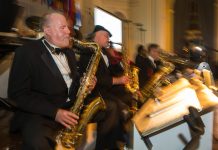 Musicians in tuxedos playing (State Dept./D.A. Peterson)