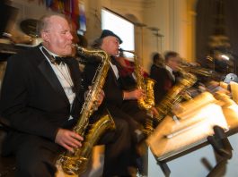 Musicians in tuxedos playing (State Dept./D.A. Peterson)