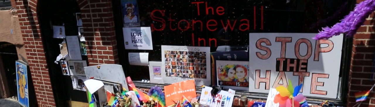The Stonewall Inn, decorated with colorful flags and signs.
