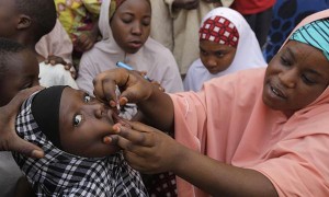 A health worker administers a polio vaccine to a girl in Nigeria. / Courtesy of TSCHIP