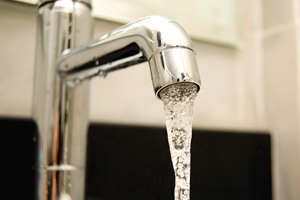 Bathtub faucet pouring water