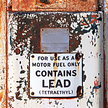 Tank with a sign: USE AS A MOTOR FUEL ONLY - CONTAINS LEAD (TETRAETHYL)