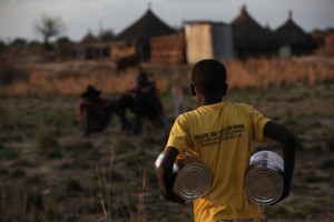 Residents of Bor County receive sorghum, oil, and lentils in exchange for road construction work they completed as part of the Catholic Relief Services led Jonglei Food Security Program, in Jonglei, South Sudan. / CRS