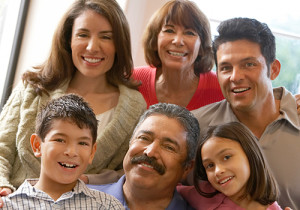 A large Hispanic family smiling