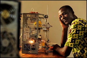 WoeLab inventor Afate Gniko with his e-waste 3D printer. / woelabo.com