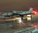 The NSF-supported University of Wyoming King Air research plane taxis across an icy tarmac.