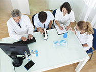 group of lab techs meeting at a table