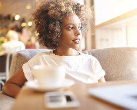 Young african-american woman at a coffee shop