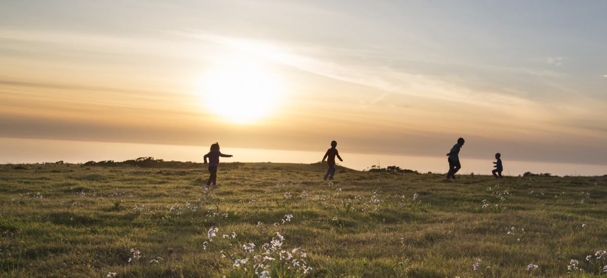 Children play along the California coast