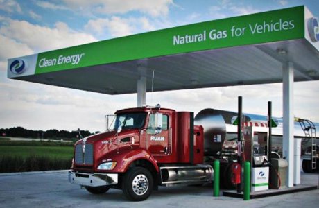 Photo of semi at natural gas pump.