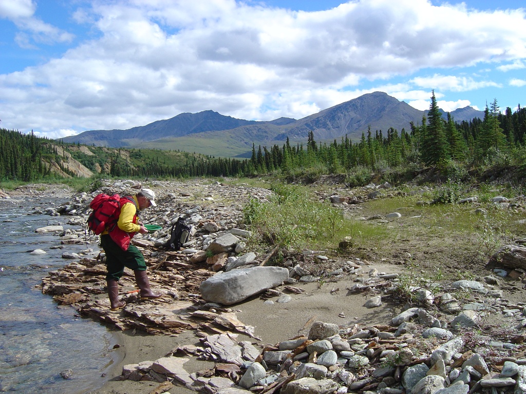 An employee conducts stream research, BLM photo