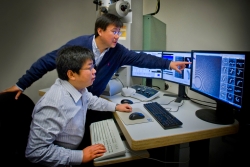 Gang Ren and Lei Zhang at Berkeley Lab's Molecular Foundry were part of a team that found new evidence to explain how cholesterol is moved from HDLs to LDLs. | Photo by Roy Kaltschmidt, Berkeley Lab