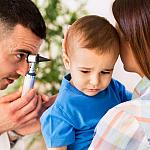 Otolaryngologist examining a child’s ear