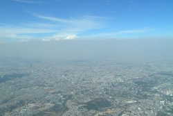 A heavy layer of air pollution, a mix of aerosol particles and vapors, obscures the view over Mexico City. Two studies by the Pacific Northwest National Laboratory show the importance of including the small-scale effects of aerosols in climate modeling. | Image courtesy of PNNL