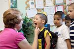 health worker examining children