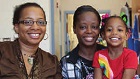 two women and a girl at school