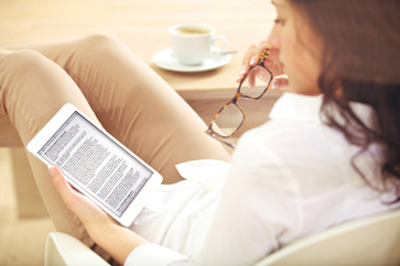 	Photo of a woman reading a fact sheet.