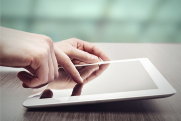 	hands and tablet computer