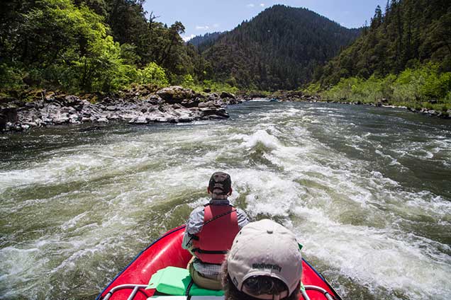 Ever visited a film set? No? How about rafting on one?!  Alongside OregonÃƒÂ¢Ã¢â€šÂ¬Ã¢â€žÂ¢s picturesque Rogue River, John Wayne and Katherine Hepburn shot their 1975 film, Rooster Cogburn. And now these public lands can serve as your very own personal backdrop where youÃƒÂ¢Ã¢â€šÂ¬Ã¢â€žÂ¢re the star of a movie about hiking, rafting, exploring, and more!  Sound good? Then letÃƒÂ¢Ã¢â€šÂ¬Ã¢â€žÂ¢s get ready for our close-up with this cinematic selection of new and historic photos from the Rogue River!  The Rogue River is located in southwestern Oregon and flows 215 miles from Crater Lake to the Pacific Ocean. The 84 mile, Congressionally-designated "National Wild and Scenic" portion of the Rogue begins 7 miles west of Grants Pass and ends 11 miles east of Gold Beach.  The Rogue was one of the original eight rivers included in the Wild and Scenic Rivers Act of 1968. The Rogue National Wild and Scenic River is surrounded by forested mountains and rugged boulder and rock-lined banks. 