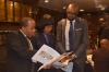 Martin Ezemma, MBDA Business Development Specialist, explains the event itinerary to a pair of attendees during the Power Africa and Agribusiness Summit Jan.13, 2016, at The National Press Club in Washington, D.C. 