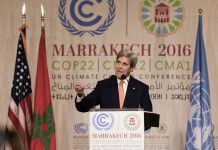 Secretary of State John Kerry speaking at podium (© AP Images)