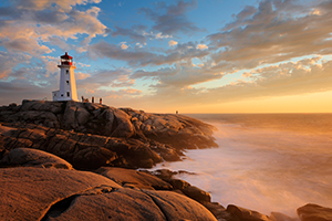 Sunset over a lighthouse on the coast