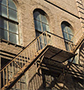 Fire escape of brick building.