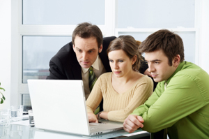 Three people in office setting