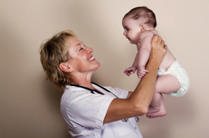 Doctor Carrying Child