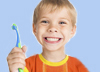 Boy holding toothbrush