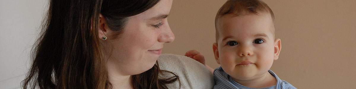 mom holding baby