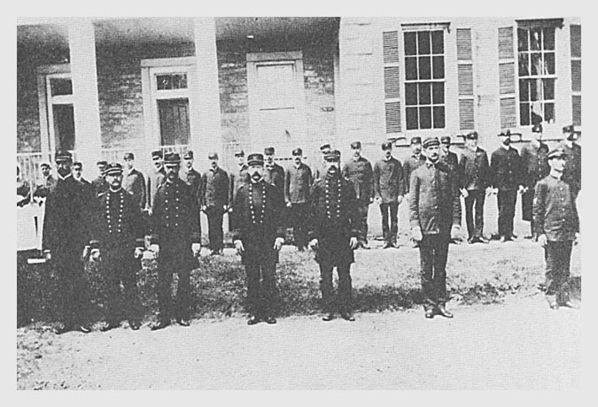 MHS officers (front row, second through fifth men) and other employees.