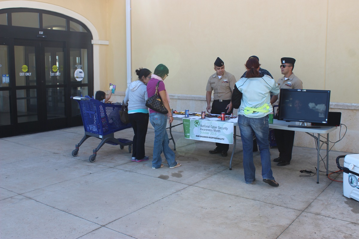 NCTL Det Rota cybersecurity team hosts a cyber-awareness booth outside Naval Station Rota Navy Exchange and Commissary.