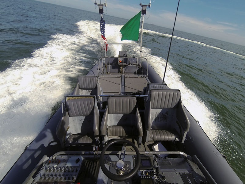 An unmanned rigid-hull inflatable boat operates autonomously during an Office of Naval Research (ONR)-sponsored demonstration of swarmboat technology held at Joint Expeditionary Base Little Creek-Fort Story. During the demonstration four boats, using an ONR-sponsored system called CARACaS (Control Architecture for Robotic Agent Command Sensing), operated autonomously during various scenarios designed to identify, trail or track a target of interest. U.S. Navy photo by John F. Williams/Released 