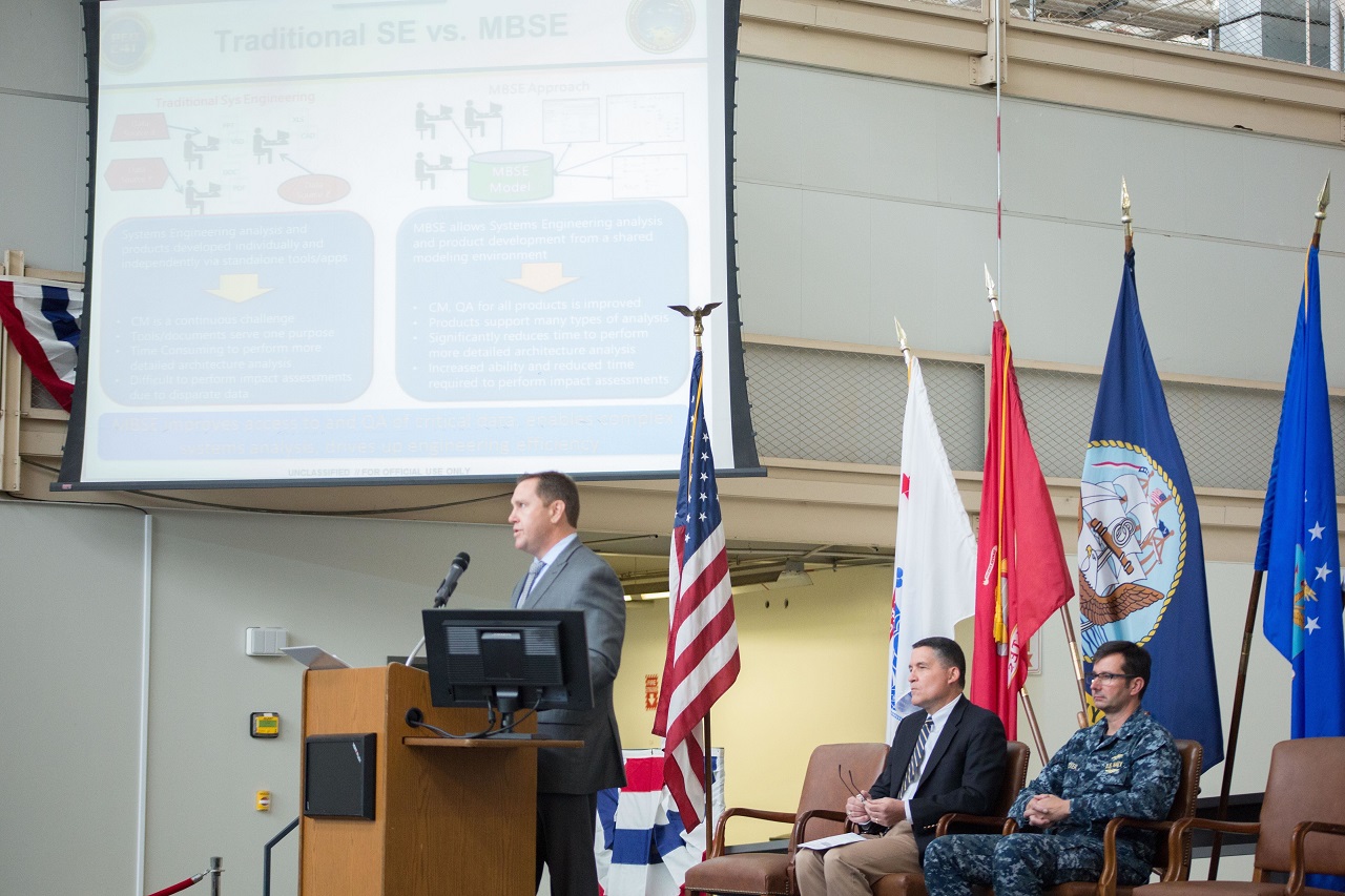 SAN DIEGO (Nov. 28, 2016) Brent Starr, Principle Assistant Program Manager (PAPM) and team lead for the Navy’s Undersea Integration Program Office (PMW 770) Model Based Systems Engineering (MBSE) team provides an overview of MBSE to personnel from the Program Executive Office for Command, Control, Communication, Computers and Intelligence (PEO C4I) during an all-hands awards ceremony. The team was initially presented the award during an awards ceremony at the Pentagon Nov. 17, 2016. PMW 770 uses MBSE to quickly integrate commercial off-the shelf technology and modernize the Navy’s current technologies to work with already existing systems.   Navy photo by Krishna M. Jackson/Released 