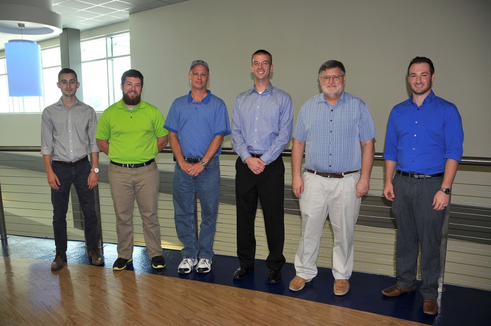 Naval Surface Warfare Center Panama City Division (NSWC PCD) employees pose for a photo with Naval Research Enterprise Internship Program (NREIP) interns at a Capture the Flag event at Gulf Coast State College on July 15, 2016. The NSWC PCD employees were the first team to successfully complete the Capture the Flag cybersecurity awareness challenge. Pictured from left to right: NREIP intern Trevor Phillips, David Cole, Tim McCabe, Josh Westmoreland, Mark Bates and NREIP intern Daniel Jermyn. U.S. Navy Photo by Katherine Mapp/Released