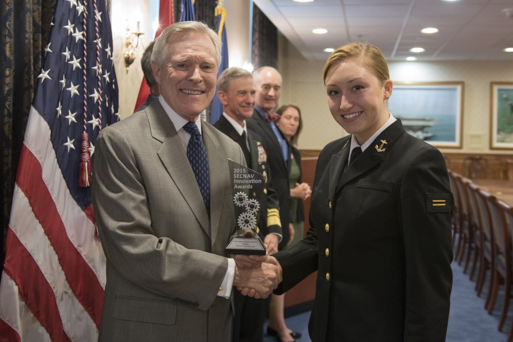WASHINGTON (April 21, 2016) Secretary of the Navy (SECNAV) Ray Mabus presents Midshipman Annie McDonald from Navy ROTC Unit, The George Washington University with the 2015 SECNAV Innovation Award for the Innovation Scholar (Midshipmen) category during a ceremony at the Pentagon.  U.S. Navy photo by Mass Communication Specialist 2nd Class Armando Gonzales   