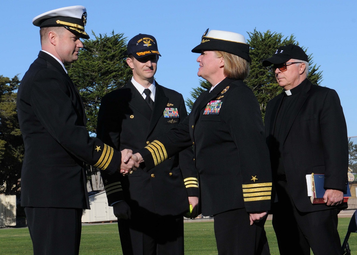 Capt. Maureen Fox, commanding officer, Center for Information Dominance (CID), as he assumes command of CID Unit Monterey during a change of command ceremony at Presidio of Monterey. Newsome relieved Cmdr. Chris Slattery as commanding officer for the Navy command responsible for developing fleet-ready Sailors who possess the basic foreign language skills necessary to support the nation's warfighting and intelligence operations. Photo by Mass Communication Specialist 2nd Class Matthew Perreault