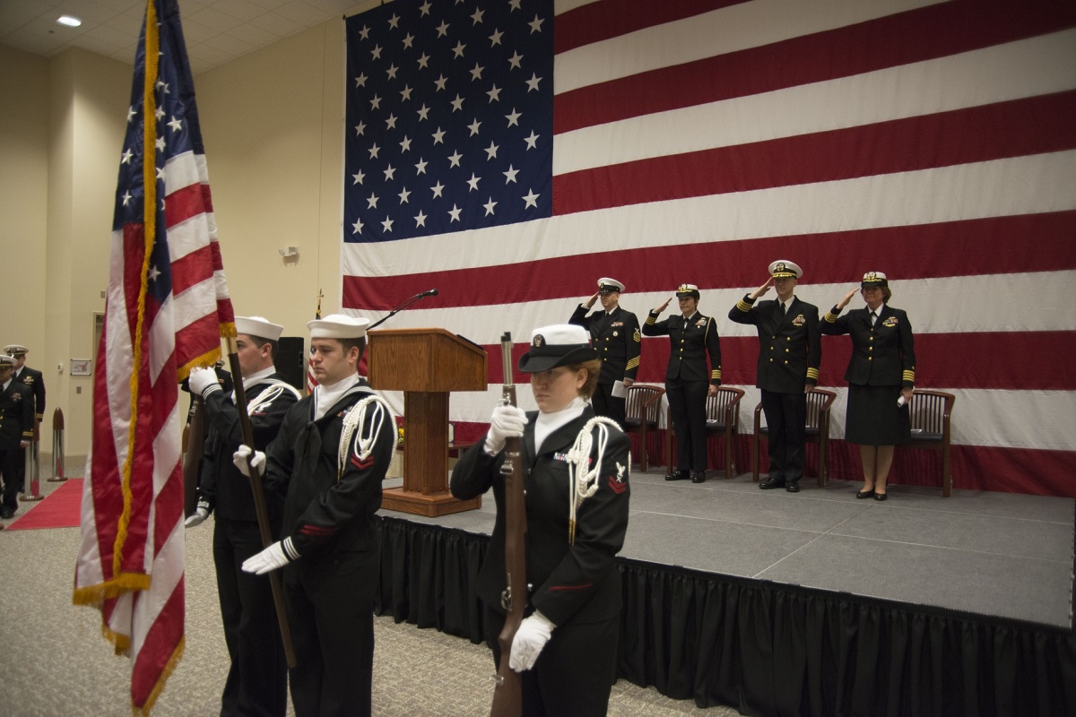 NAVY INFORMATION DOMINANCE FORCES, Suffolk, Va. (December 04, 2015) -- Capt. Roberta Belesimo, right, Capt. Michael “Barry” Tanner, Capt. Kelly Aeschbach, and ITC John Cook salute as the colors are paraded during Navy Reserve Navy Information Dominance Forces Operations change of command.  Capt. Roberta Belesimo relieved Capt. Michael “Barry” Tanner as commanding officer of NR NAVIDFOR Ops during the ceremony held in the Navy Global Network Operations and Security Center. U.S. Navy photo by Michael J. Morris
