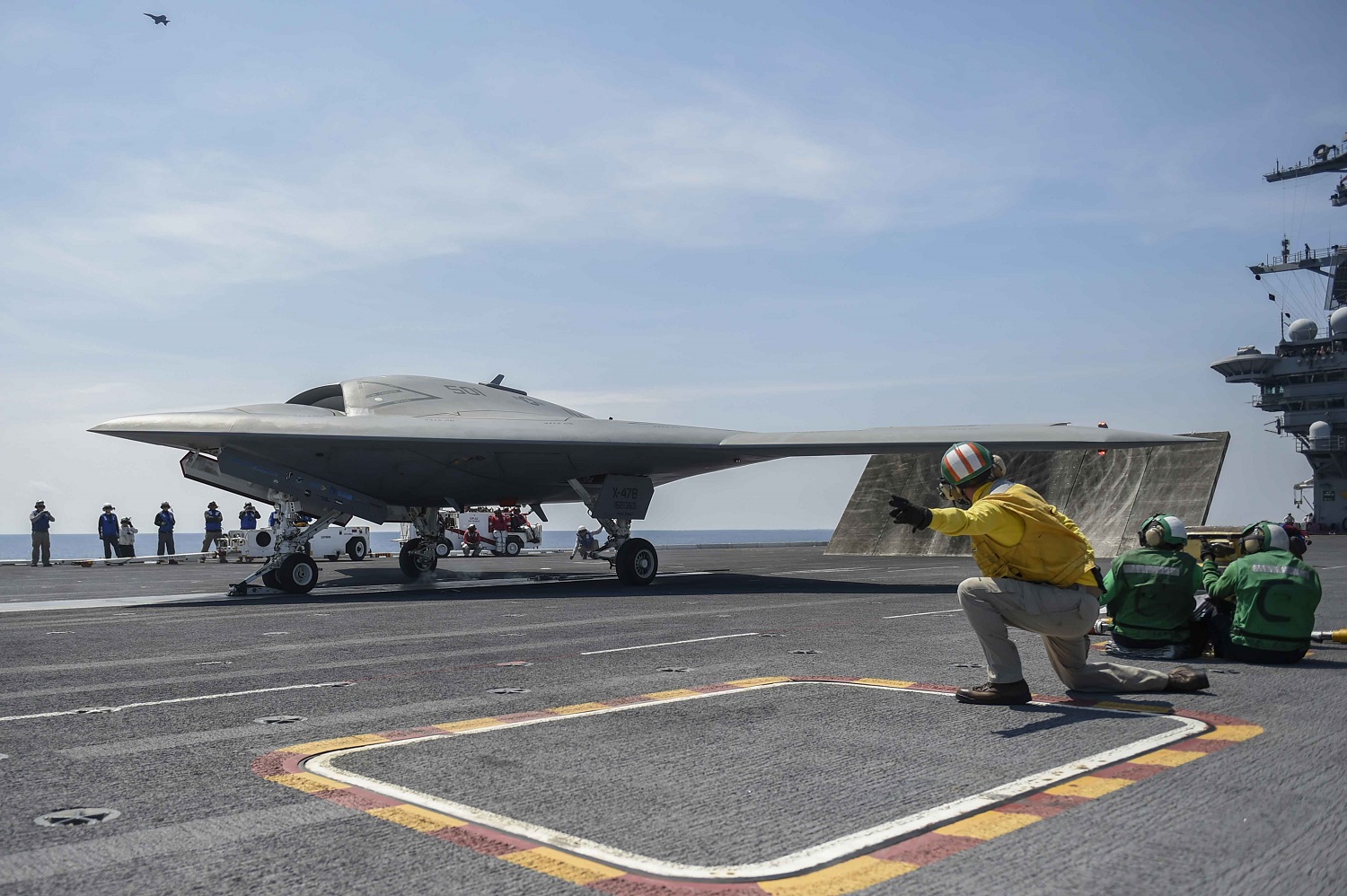 140818-O-SW468-027 ATLANTIC OCEAN (Aug. 17, 2014) The Navy's unmanned X-47B launches from the aircraft carrier USS Theodore Roosevelt (CVN 71). The aircraft completed a series of tests demonstrating its ability to operate safely and seamlessly with manned aircraft. U.S. Navy photo