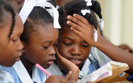 Schoolchildren concentrate at Ecole Marie Dominique Mazzarello in Port-au-Prince, where a USAID program helped build classrooms.
