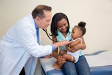 Doctor examining infant