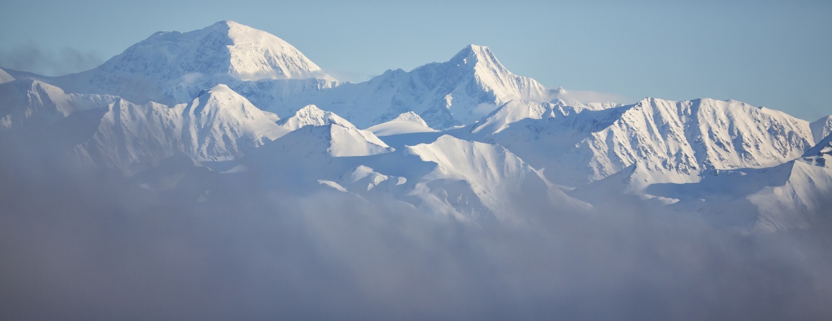 Snowy mountains in the fog at Delta Wild and Scenic River in Alaska.  Photo by Bob Wick, BLM.