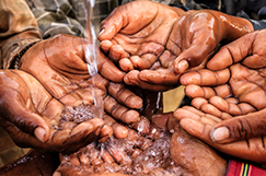 	hands under stream of water