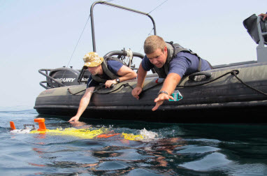 U.S. FIFTH FLEET AREA OF RESPONSIBILITY (Sept. 22, 2012) Members of the Royal New Zealand Navy Operational Dive Team deploy an autonomous underwater vehicle Remote Environmental Measuring UnitS (REMUS) during the International Mine Countermeasures Exercise. Navies from more than 30 countries are focused to promote regional security through mine countermeasure operations in the U.S. 5th Fleet area of responsibility. U.S. Navy photo. 