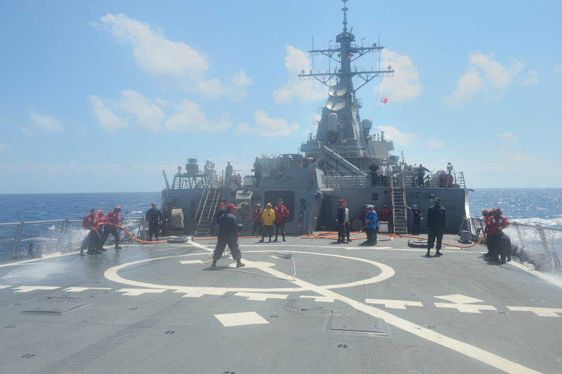 MEDITERRANEAN SEA (Aug. 15, 2014) Sailors simulate firefighting efforts during a crash and salvage drill aboard the Arleigh Burke-class guided-missile destroyer USS Ross (DDG 71). Ross, forward deployed to Rota, Spain, is conducting naval operations in the U.S. 6th Fleet area of responsibility in support of U.S. national security interests in Europe. U.S. Navy photo by Mass Communication Specialist 2nd Class John Herman.