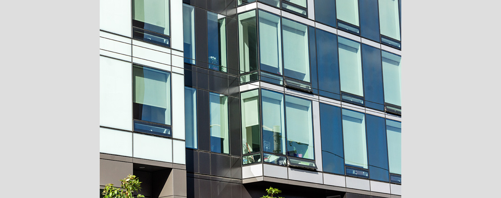 Photograph of a portion of two residential floors of a highrise building.