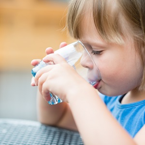 	A young girl drinking water